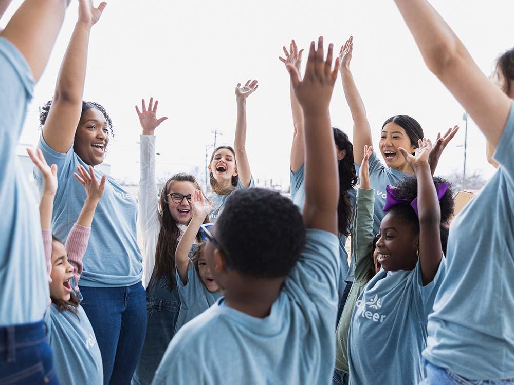 kids raising their hands